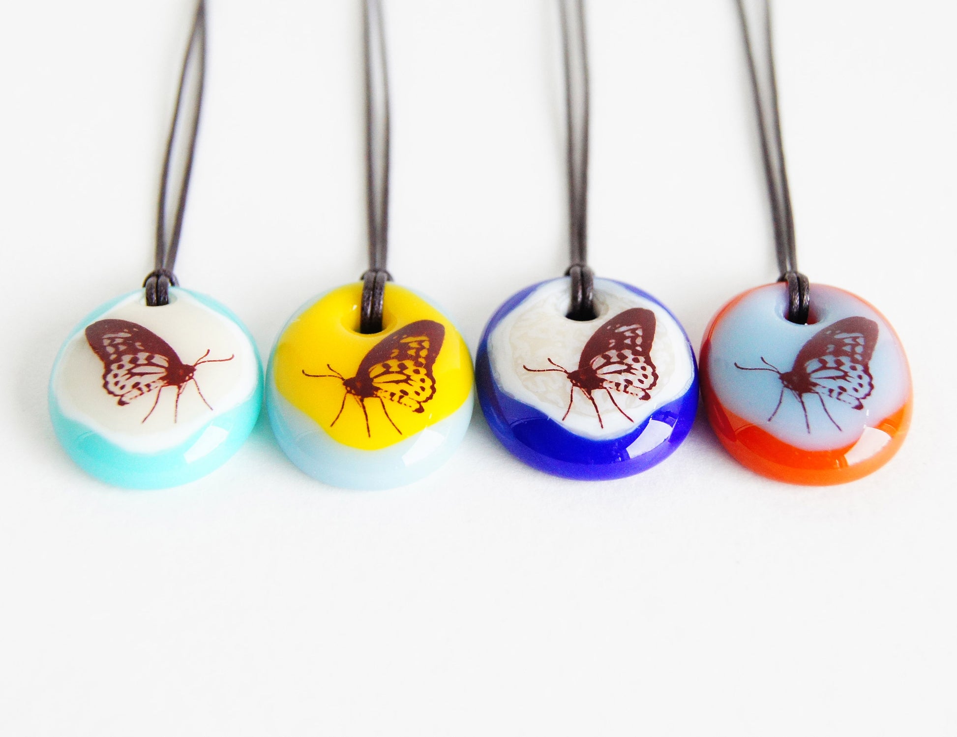 Your choice of handmade butterfly necklace on cotton cord.