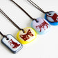Limited batch of colourful glass cat necklaces