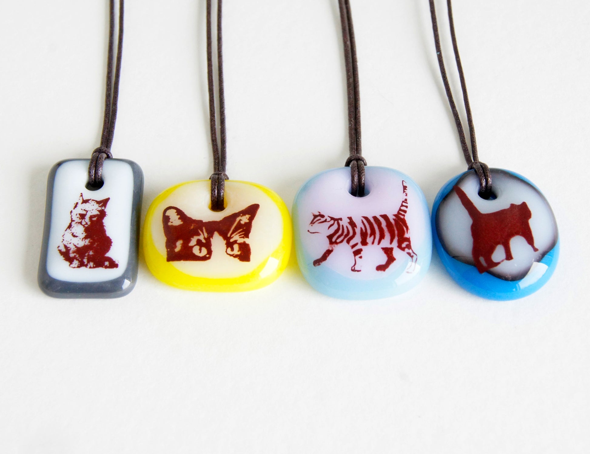 Your choice of handmade cat necklace on cotton cord. 