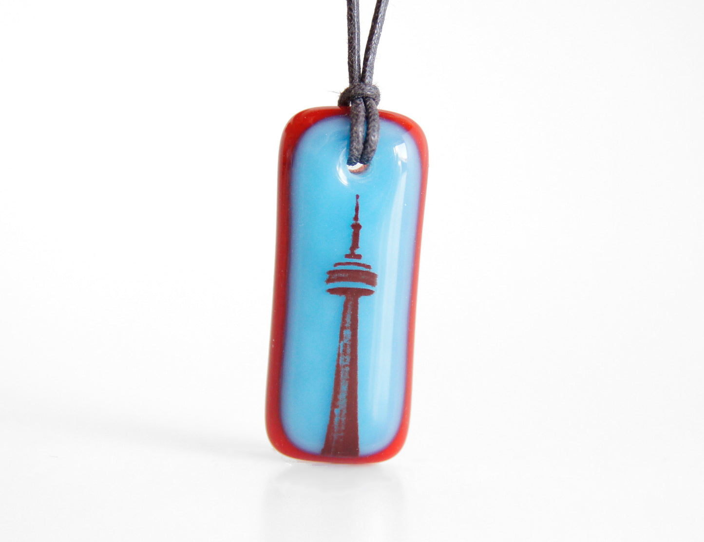 CN Tower necklace in aqua blue and red.