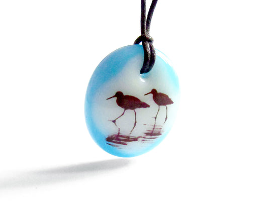 Shorebirds necklace in aquamarine blue glass.