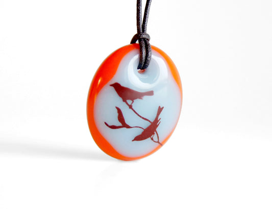 Bird branch necklace in light blue and red.