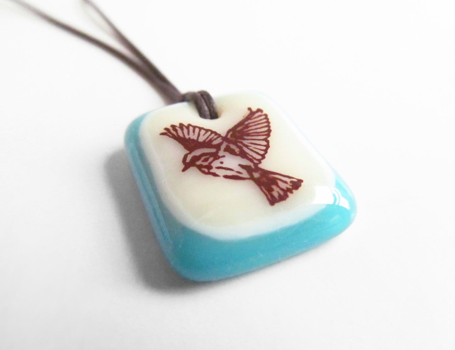 Freedom bird image on a handmade glass pendant necklace.