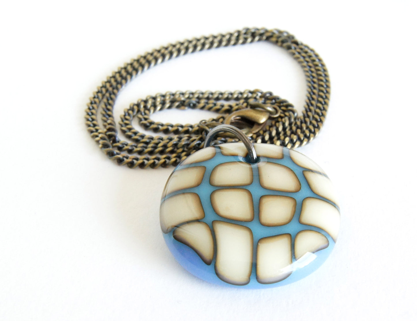 big bold statement pendant necklace in antiqued colours on chunky brass chain