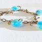 Ooak charm bracelet with fused glass patina blue drops, stainless steel tear drop beads and bronze chain