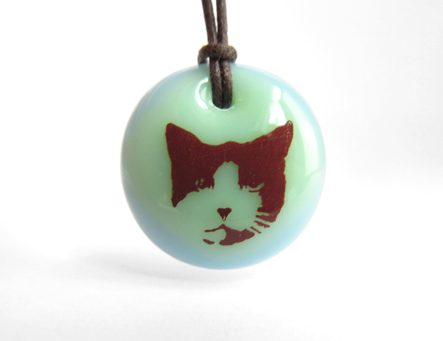 Cat Necklace in mint green and light blue.