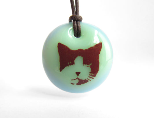 Cat Necklace in mint green and light blue.