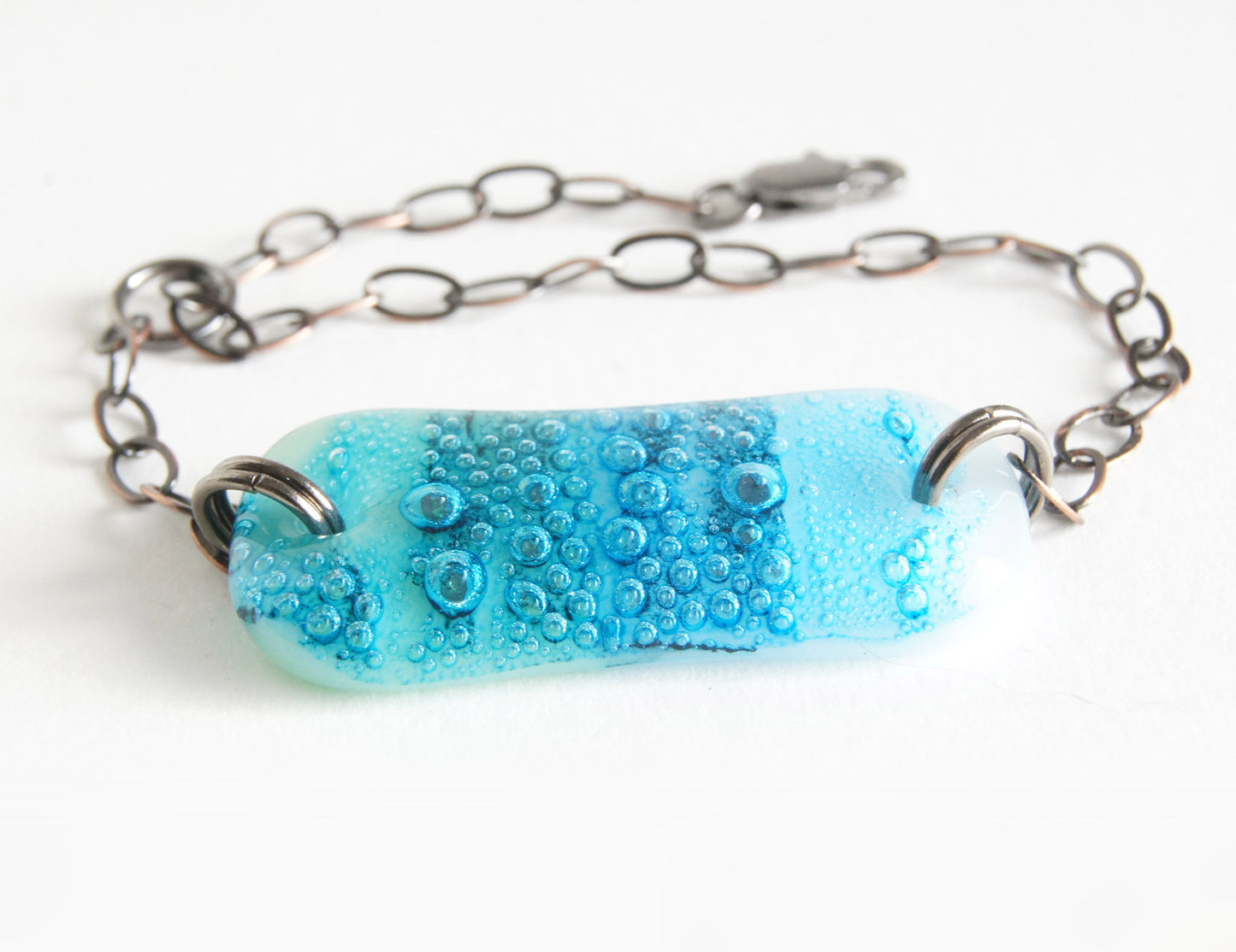 One of a kind art glass jewelry bracelet with patina copper bubbles.