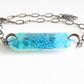 Aquamarine bracelet with glass bubbles and blue ombre design.