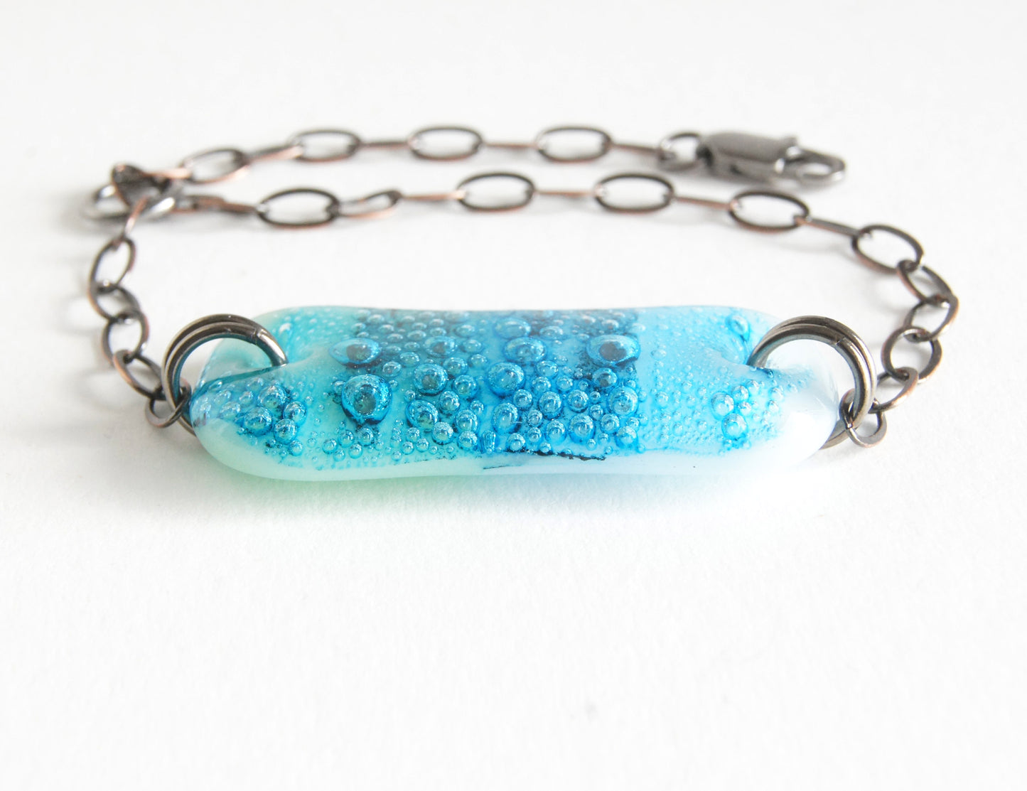 Aquamarine bracelet with glass bubbles and blue ombre design.