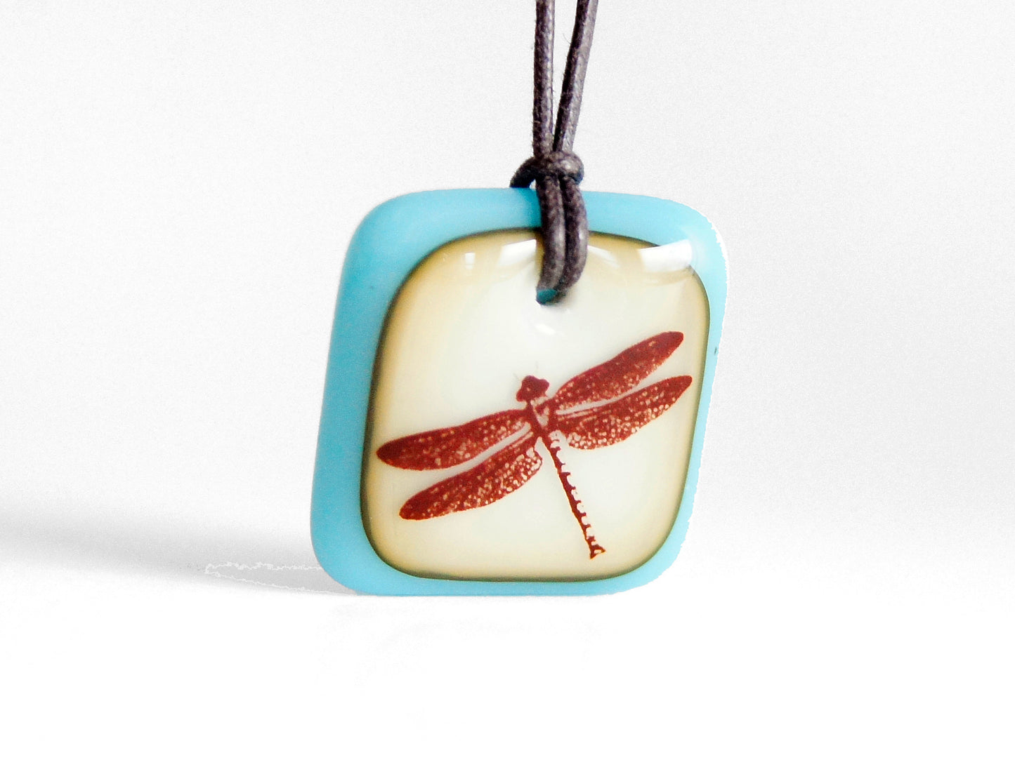 Dragonfly necklace in vintage aquamarine and caramel glass. 