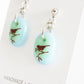 Handmade bird earrings on gift cards.