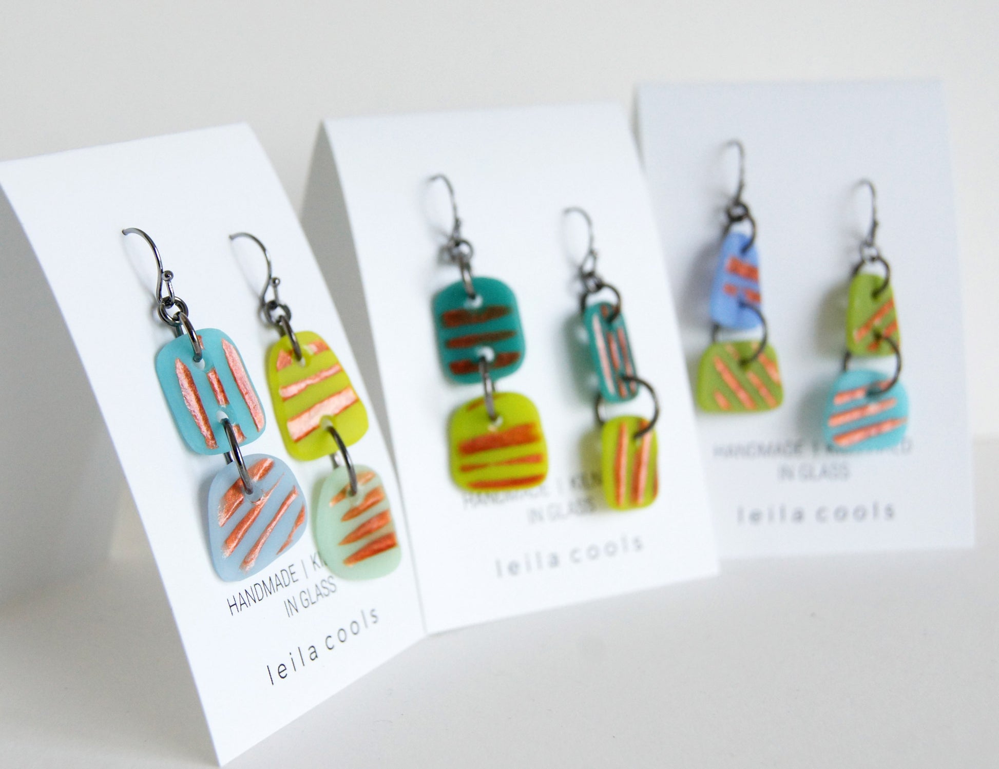 fun copper stripe earrings in blues and greens