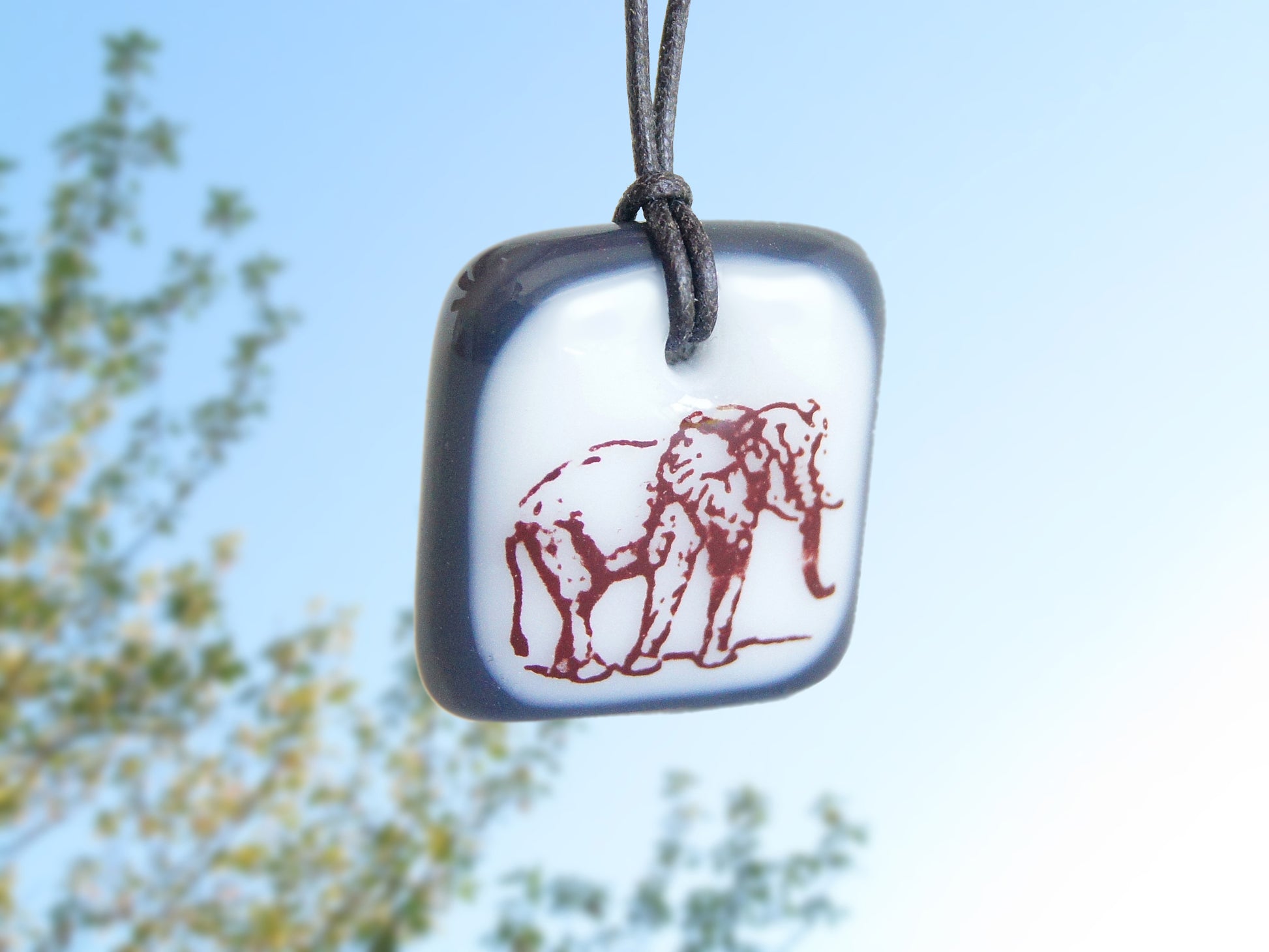 Elephant necklace in charcoal grey and white.
