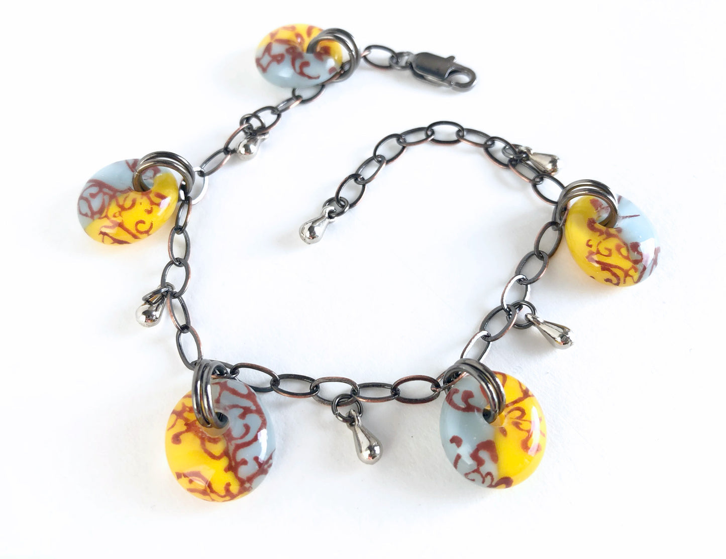 Sunny yellow and light blue glass charm bracelet.