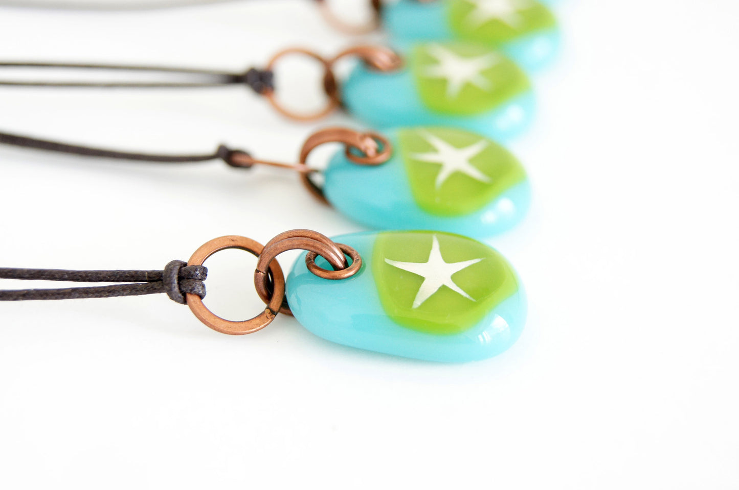 Your choice of star pendant on cotton cord.