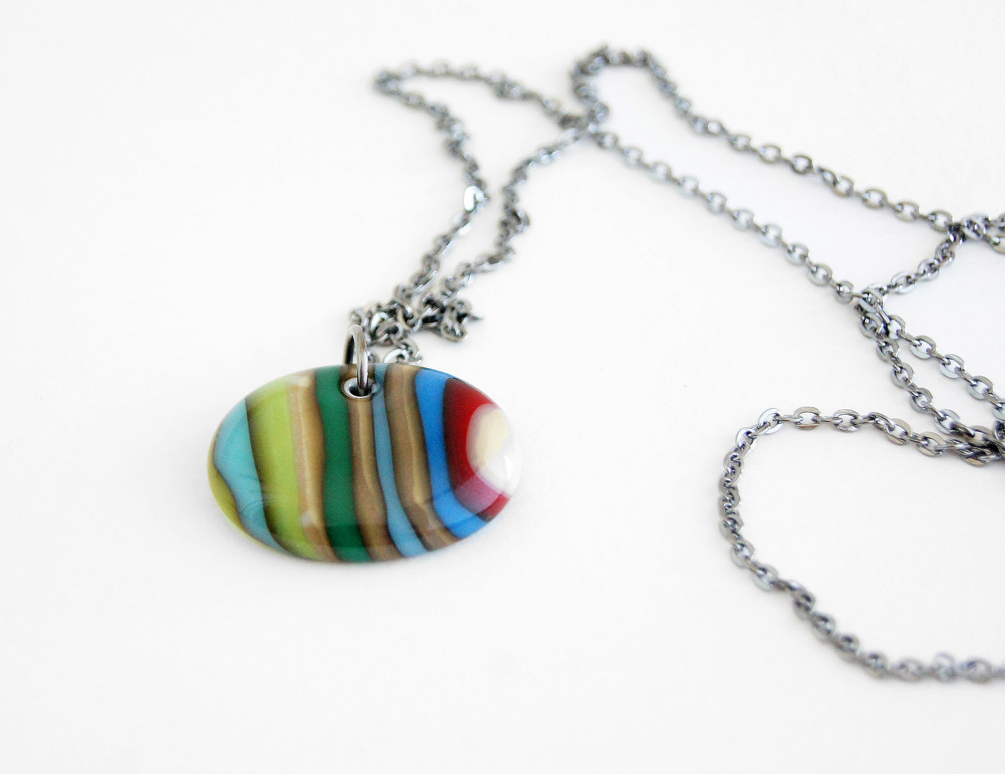one of a kind pendant necklace in antiqued glass on long chain