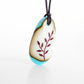 Botanical necklace with delicate leaf image. 