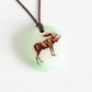 Moose necklace handmade in light green glass. 