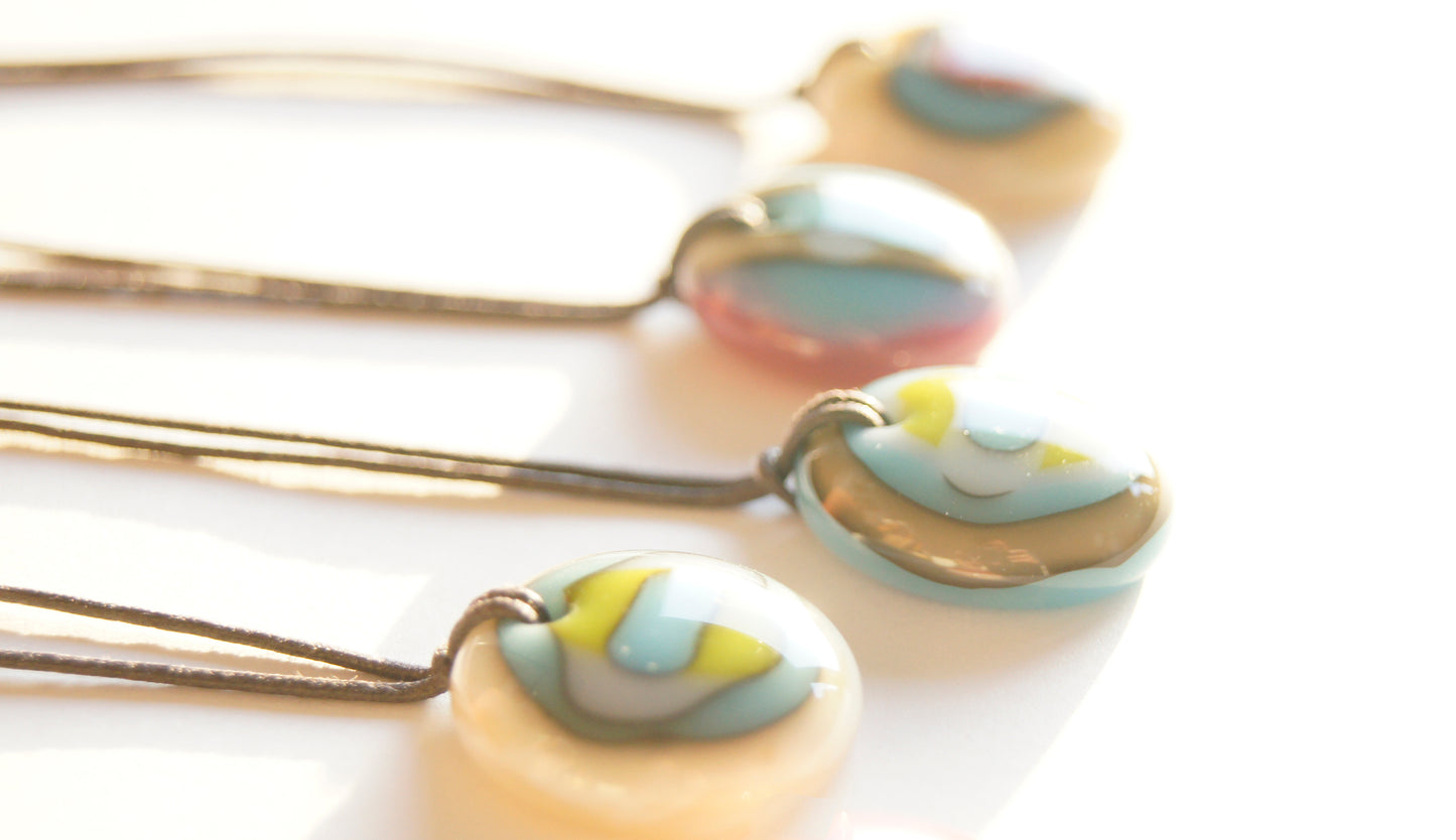 Colorful handmade art glass necklaces.