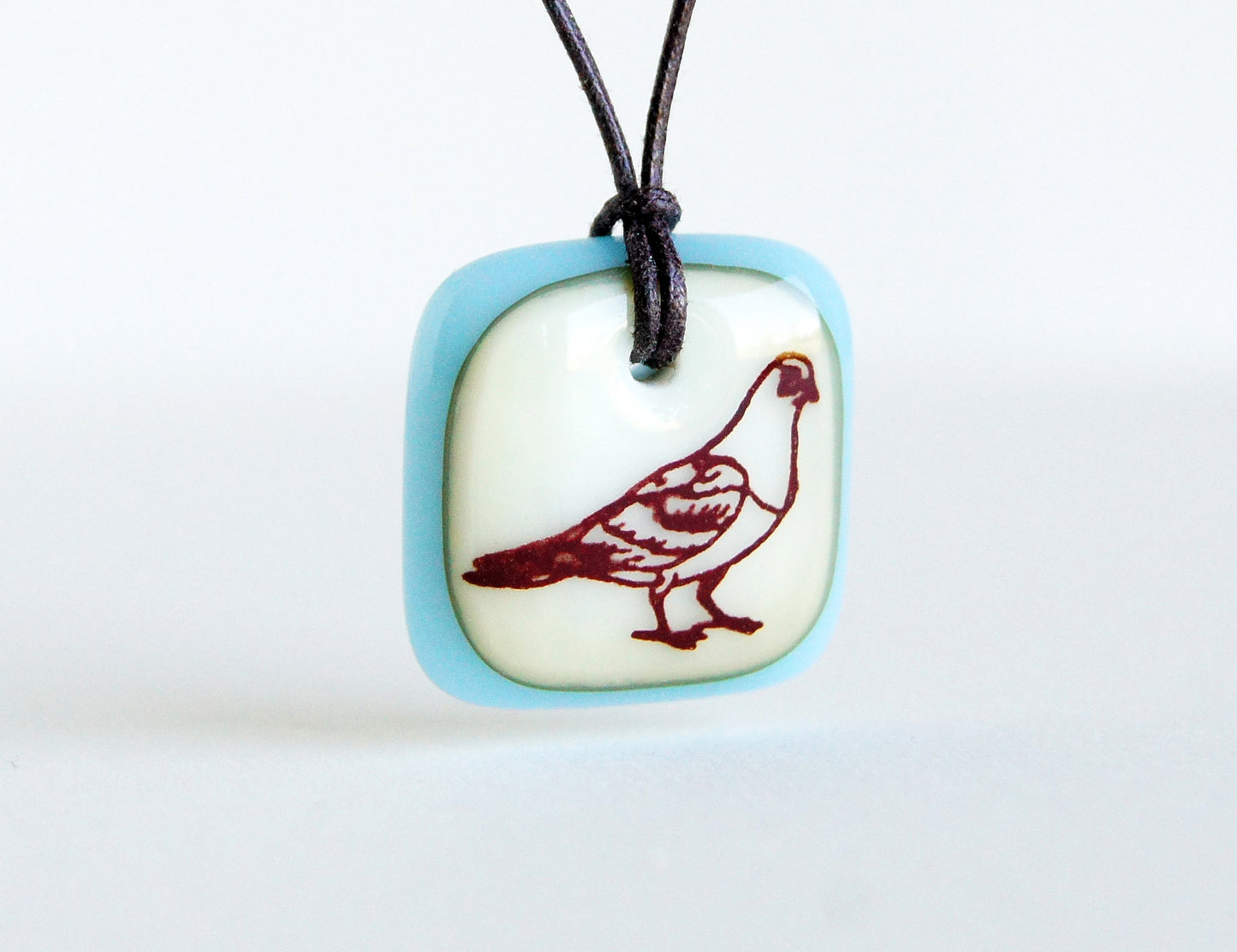 Pigeon necklace in vanilla and ice blue, handmade in glass