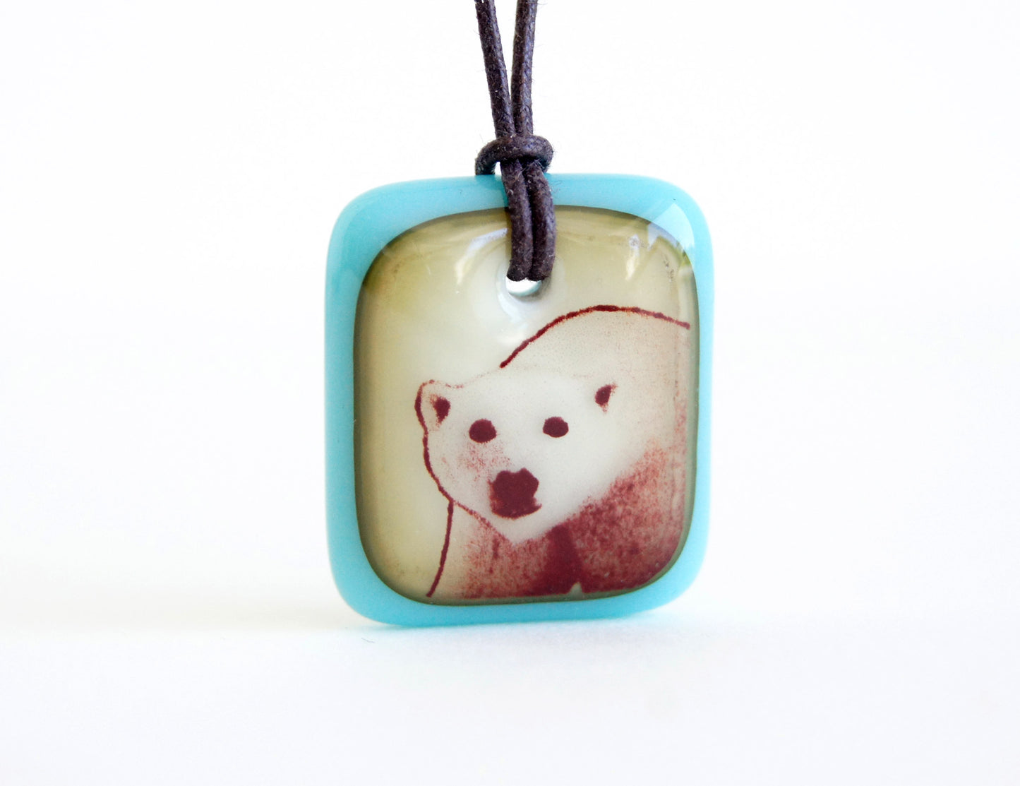 Polar bear necklace turquoise and vintage caramel glass.