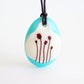Poppies necklace in turquoise glass and vintage colours. 