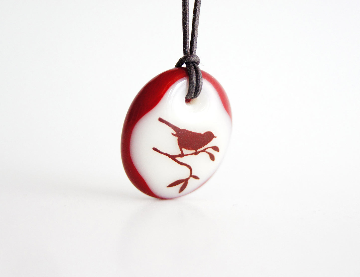 Bird in tree necklace handmade in glass.