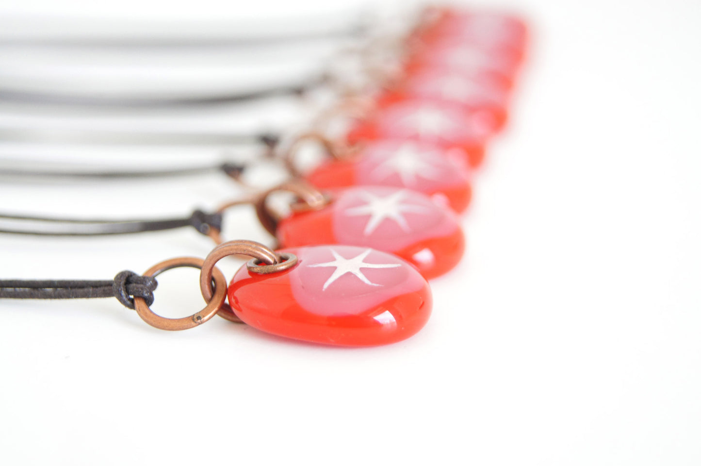 Star jewelry in red and rose pink glass.