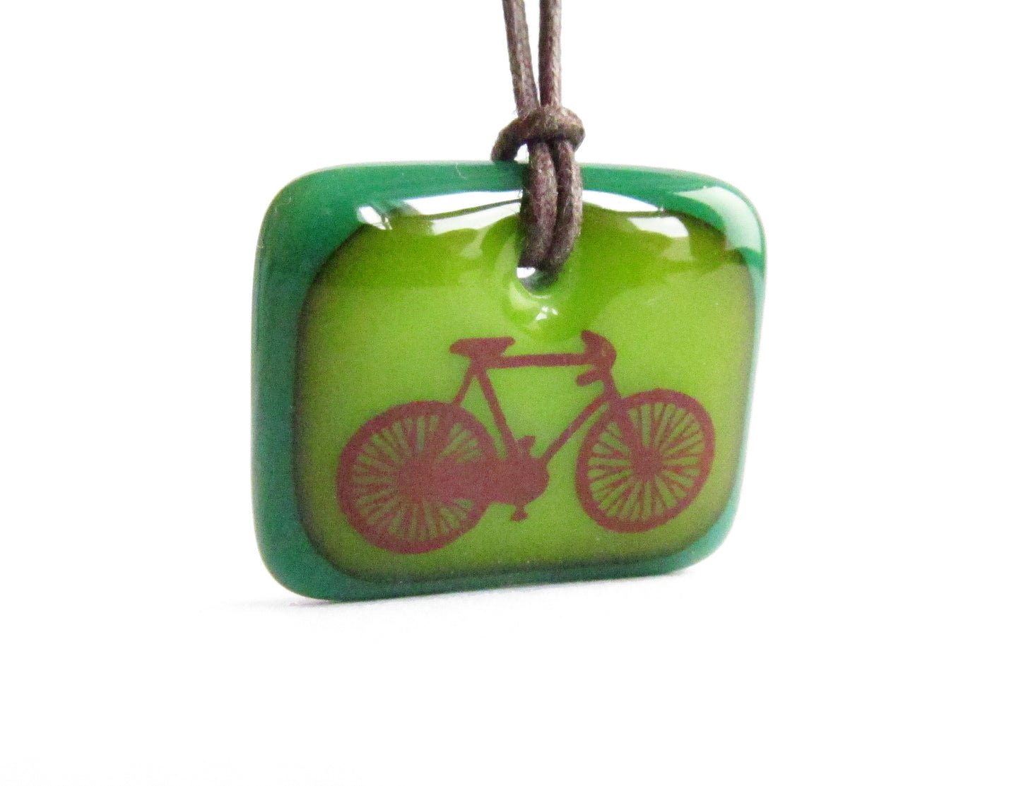Road bike pendant necklace in green.