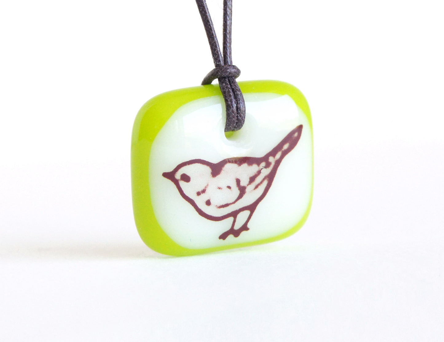 Little bird necklace in spring green and cream colours.