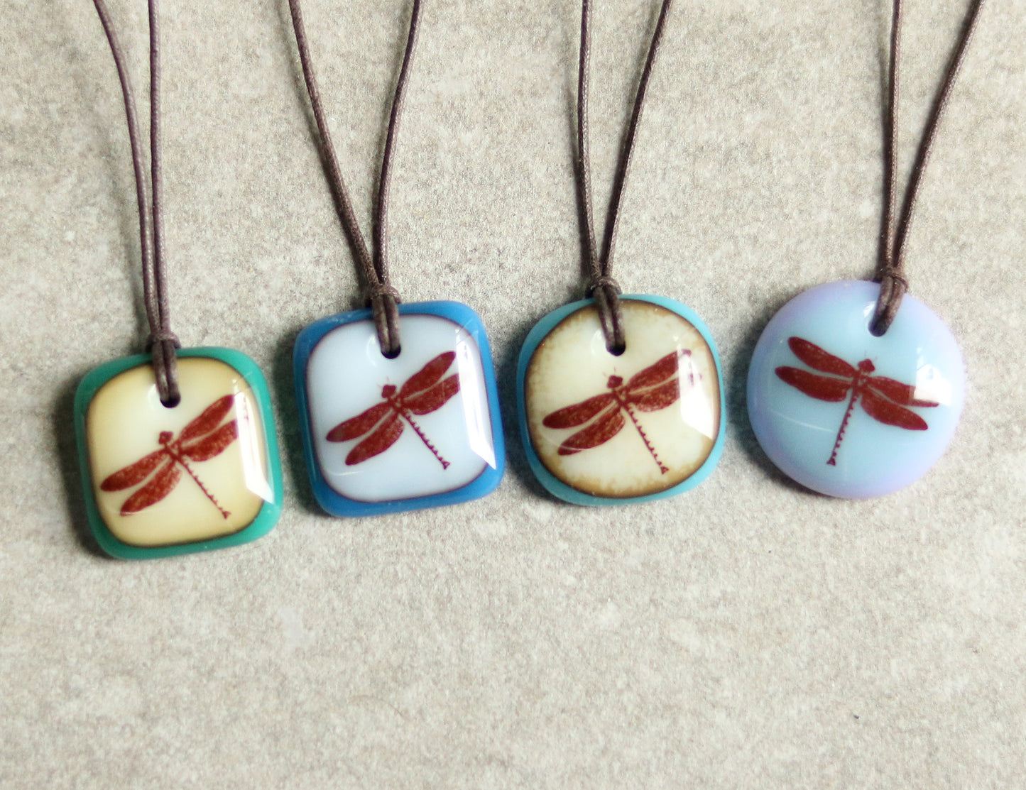 dragonfly necklaces in four different colors  - caramel green, white blue, caramel turquoise, blue lavender