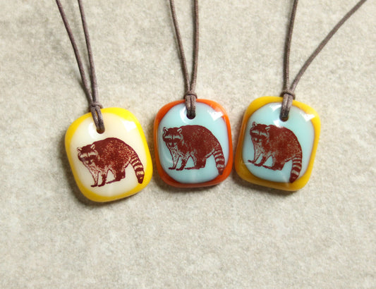 raccoon necklace in three yellow, orange green options