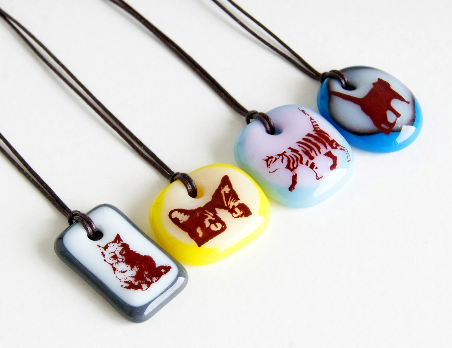 Limited batch of colourful glass cat necklaces