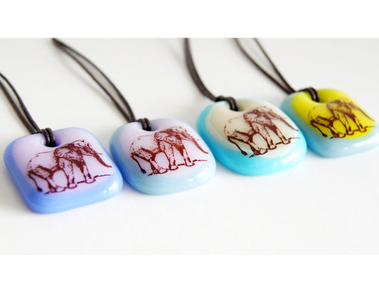 Your choice of handmade elephant necklace on cotton cord.