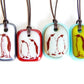 A limited batch of four Emperor Penguin glass pendant necklaces