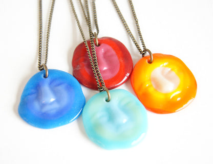 assortment of sun and moon face pendant necklaces