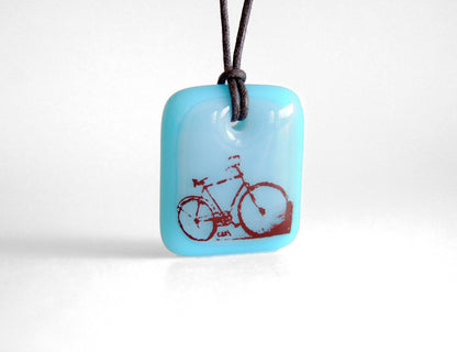 Blue bicycle necklace handmade in glass. 