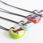 Handmade glass necklaces with canoe on a lake illustration.