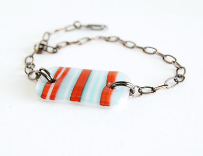 Red, white and blue (pale aqua) striped handmade glass adjustable bracelet.