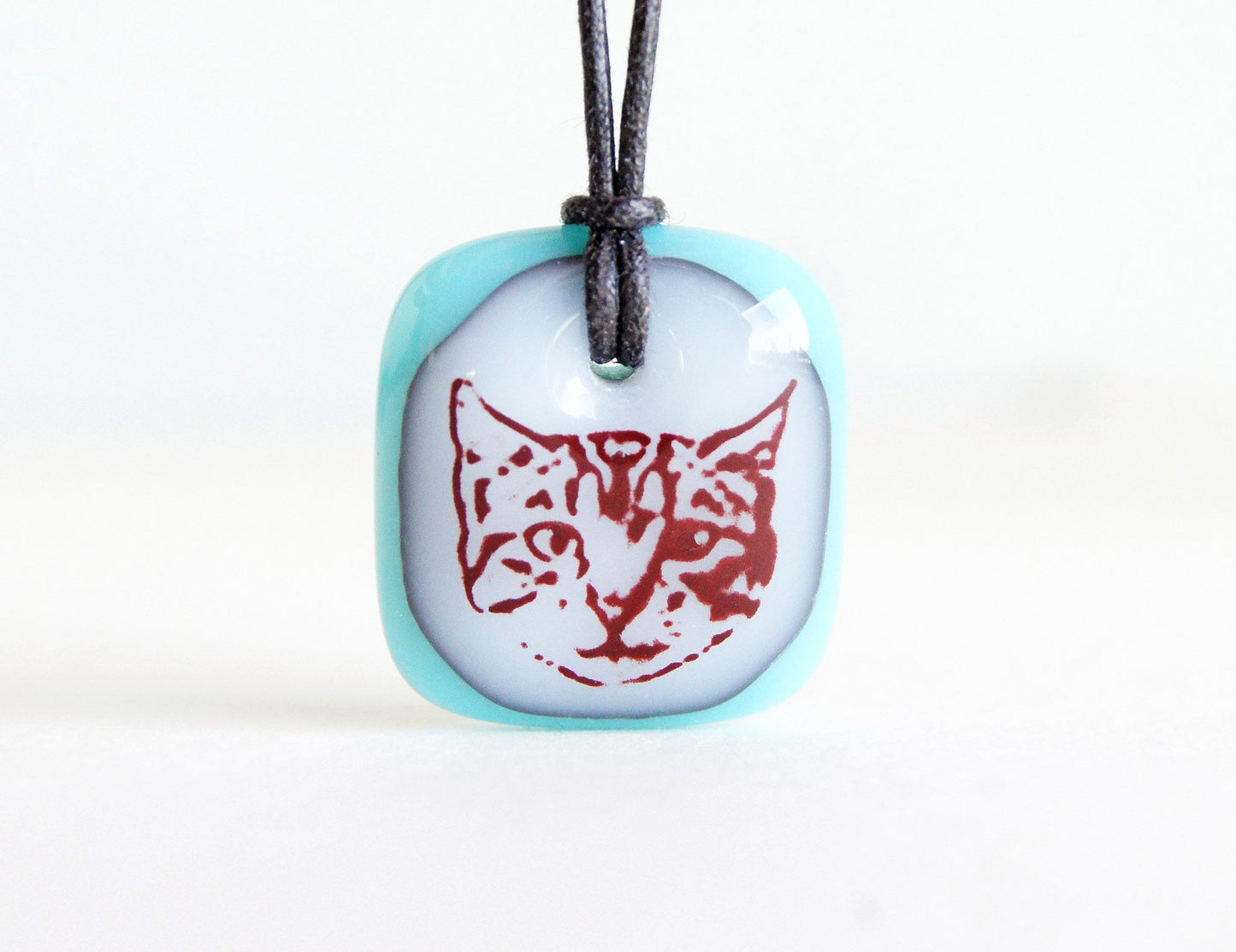 Cute tabby cat face necklace in turquoise.