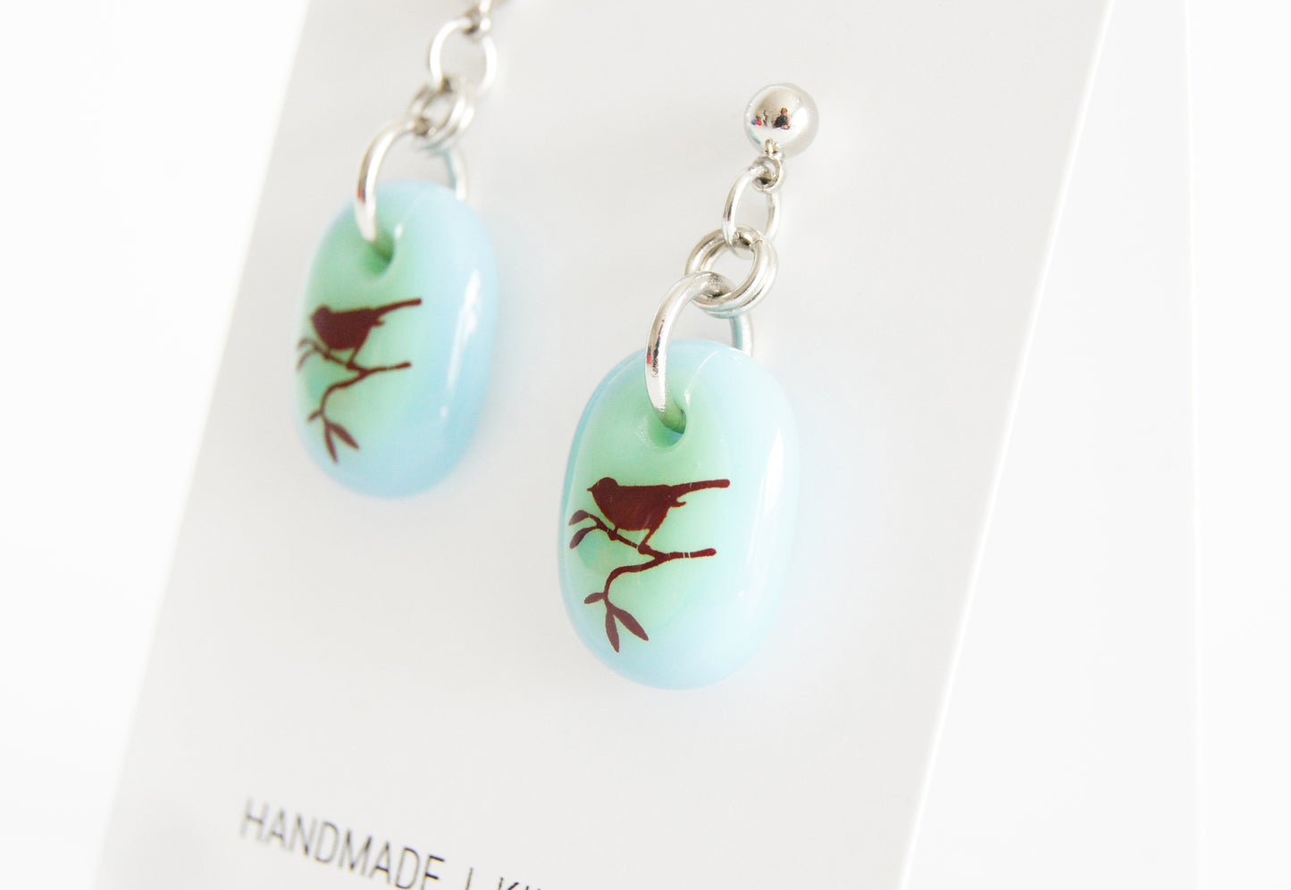 Handmade bird earrings on gift cards.