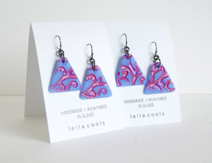 delicate glass triangle earrings with vine design