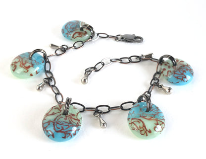 Handmade fused glass drop bracelet on bronze chain.