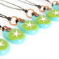 Painted silver star on green glass jewelry. 
