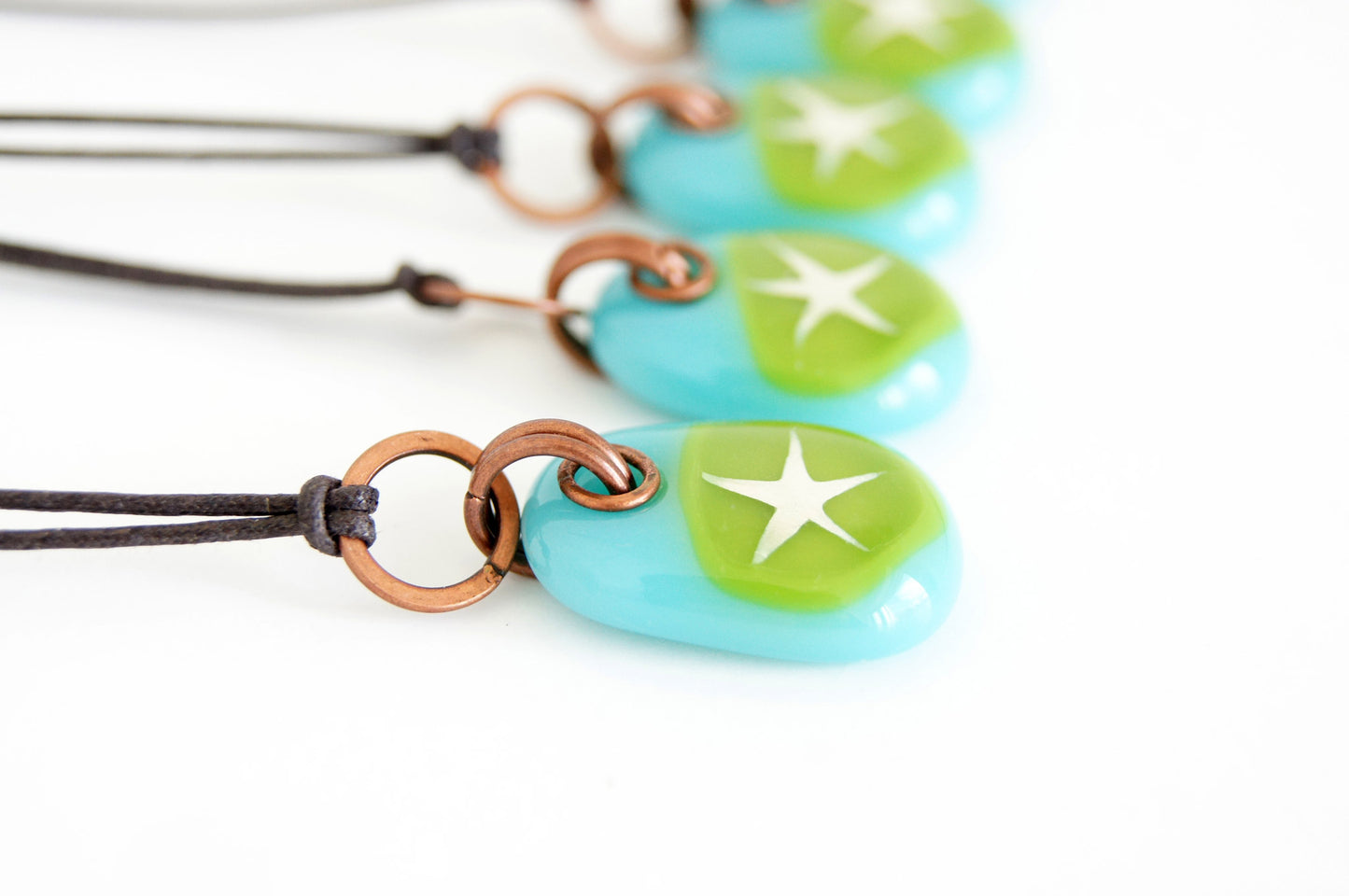 Your choice of star pendant on cotton cord. 
