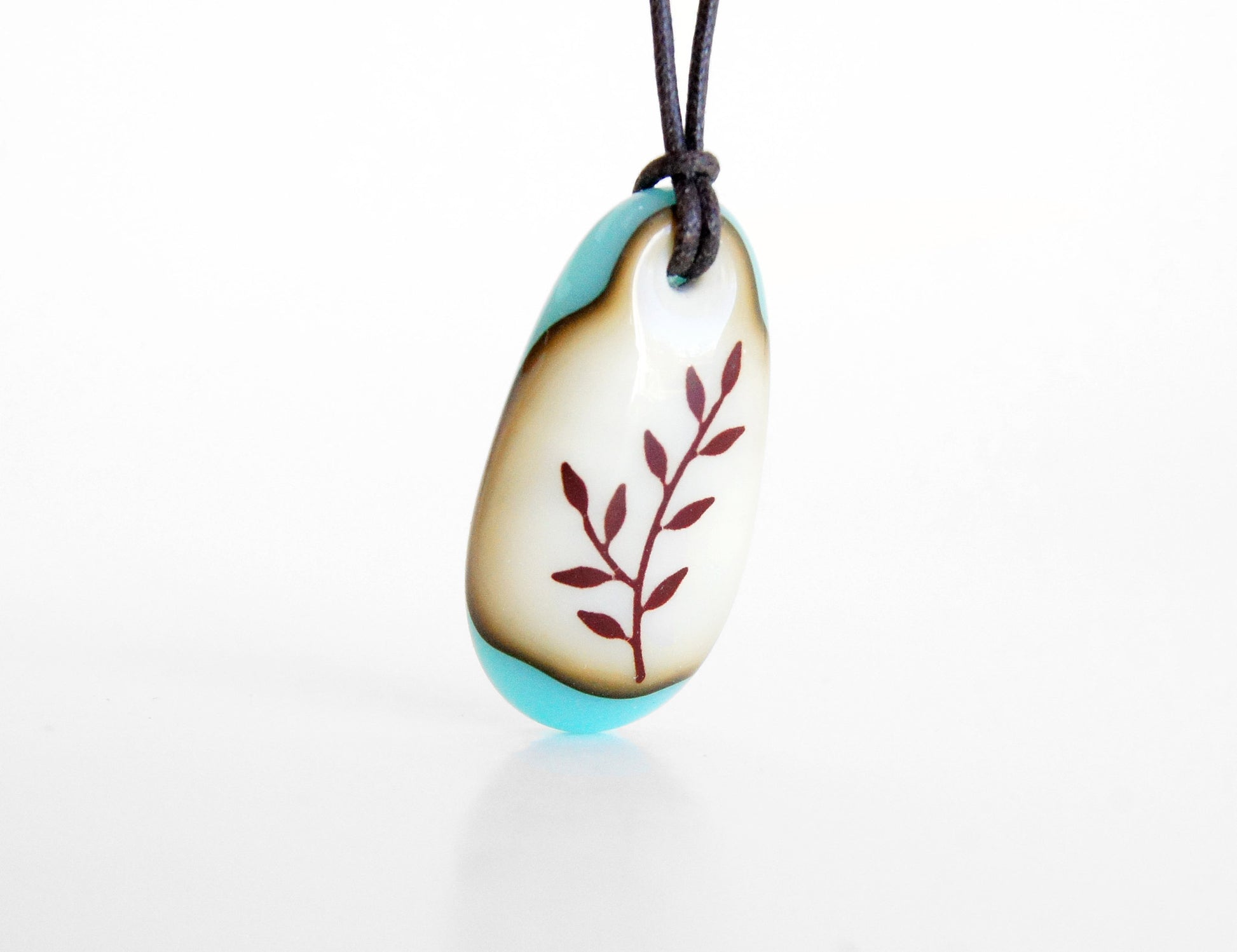Botanical necklace with delicate leaf image. 