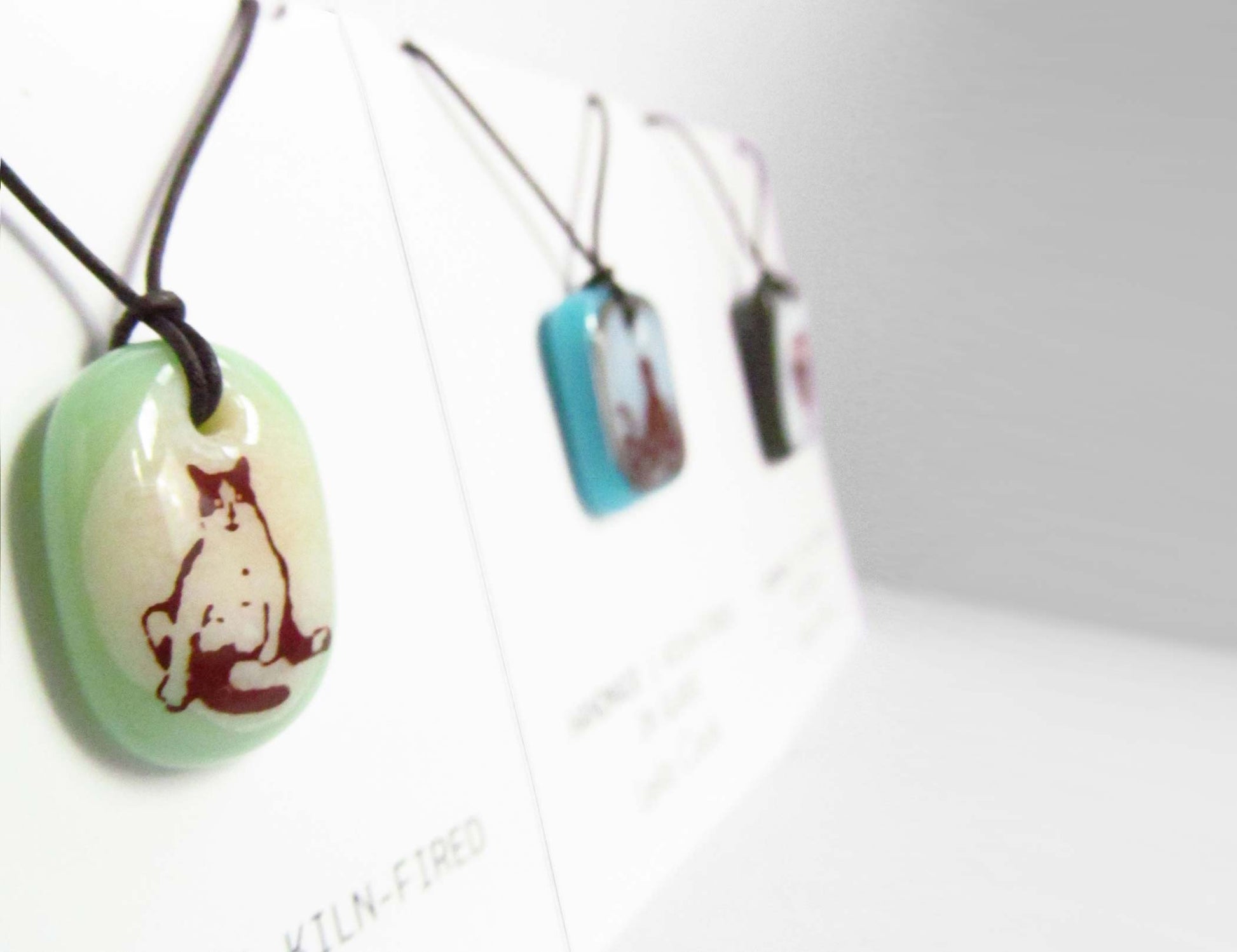 Leila Cools' necklaces displayed on retail cards. 