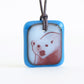 Polar bear necklace in royal blue and milk white glass. 
