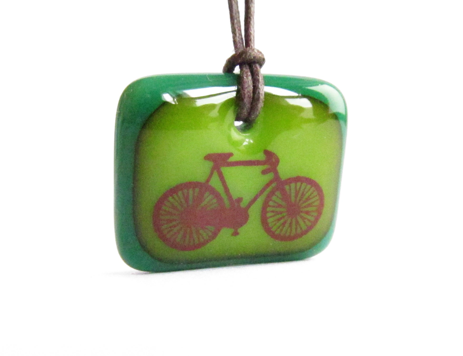 Road bike pendant necklace in green. 